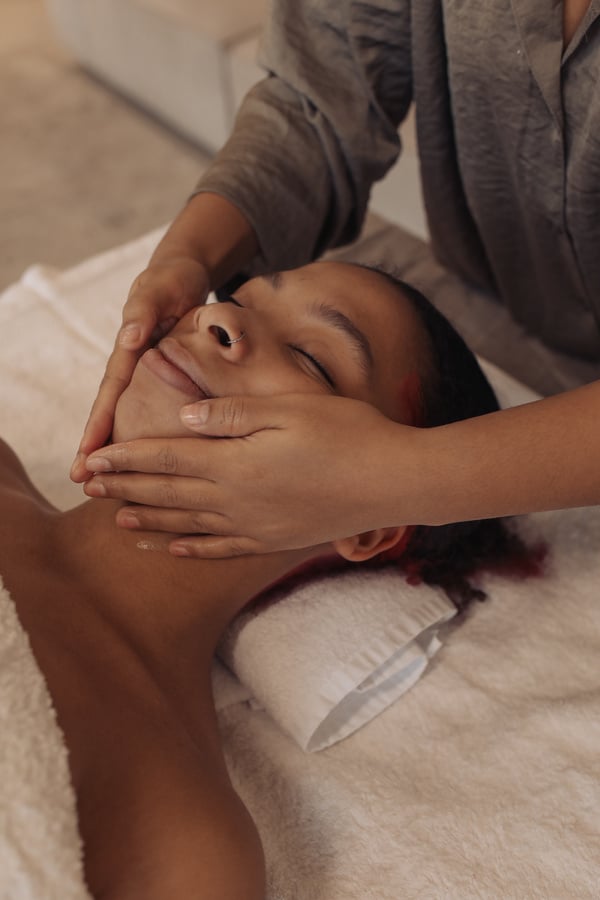 Masseuse Massaging Woman's Face